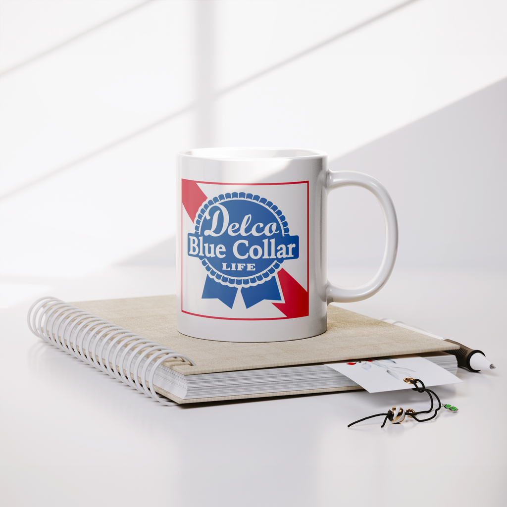Delco_Blue_Collar_Mug_Lifestyle_Notebook_Mockup.png